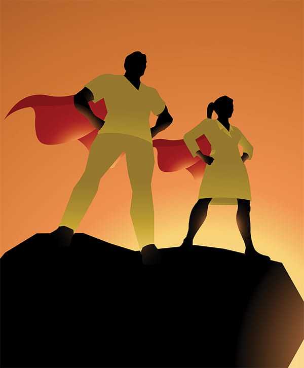 Male and female super hero silhouettes standing on a cliff